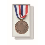 Medalha de ferro com fita tricolor azul, branca e vermelha cor castanho